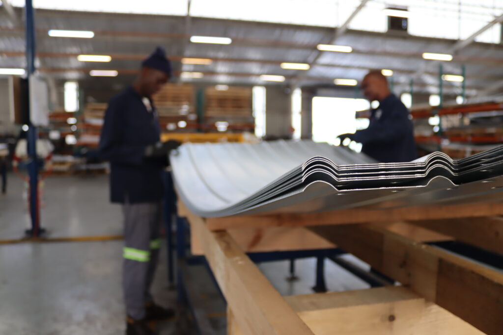 SBS Tanks Rolling department shaping flat steel into curved wall panels for modular steel water tank manufacturing.